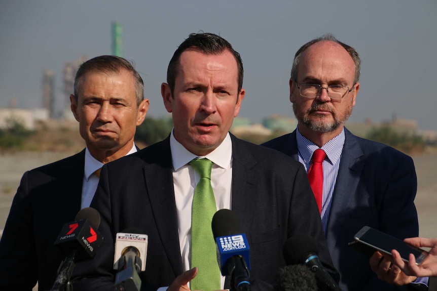 Premier Mark McGowan, Mines Minister Bill Johnston and Deputy Premier Roger Cook in the industrial area of Kwinana.