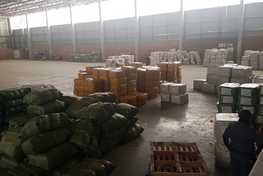 Inside a warehouse are sealed packages and boxes