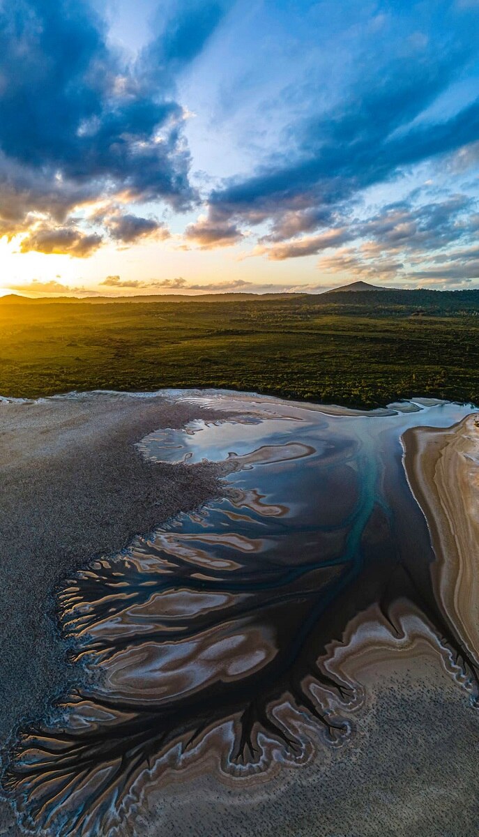 Aerial photos of Lake Cakora at Brooms Head reveal spectacular 'tree of