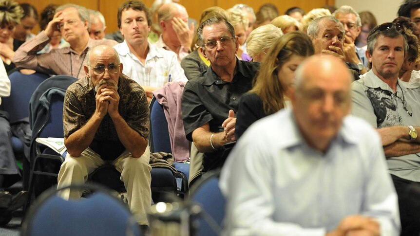 A public gallery looks on as founder of Storm Financial, Emmanuel Cassimatis, (foreground right) is questioned.