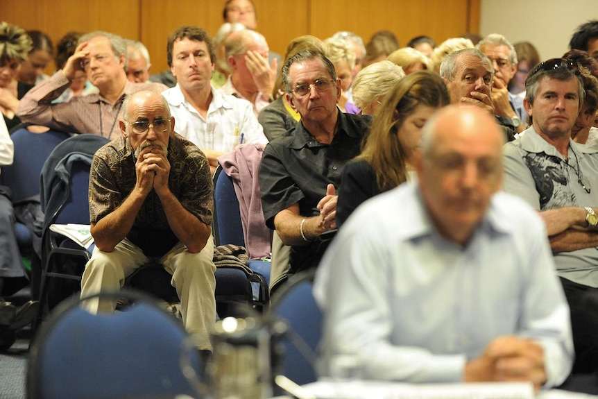 A public gallery looks on as founder of Storm Financial, Emmanuel Cassimatis, (foreground right) is questioned.