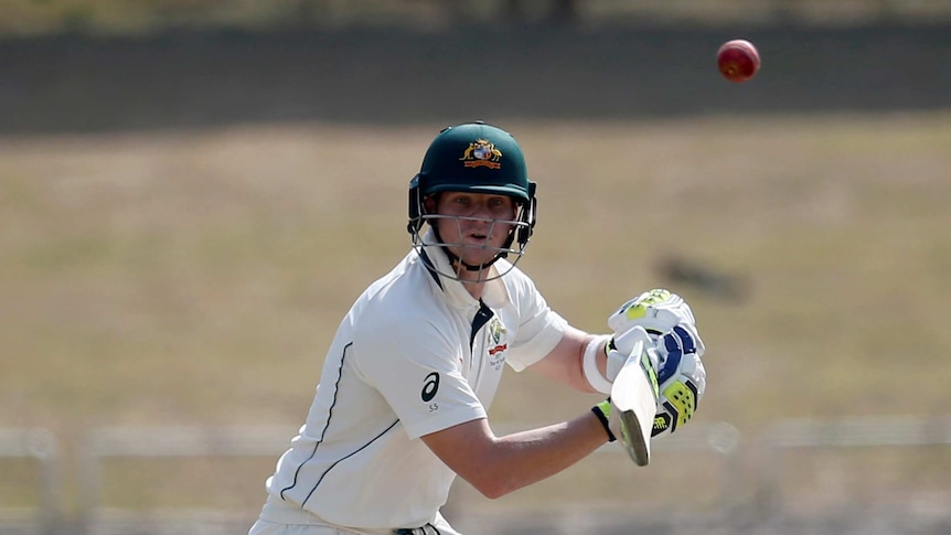 Steve Smith watches the ball