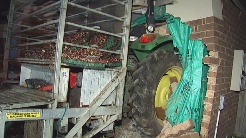 Police say the couple is lucky to be alive after the tractor smashed into the house.