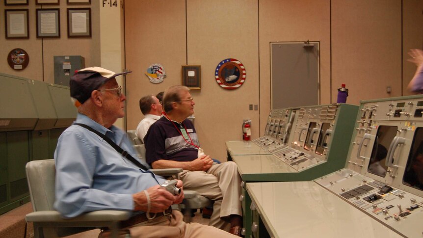 Tony Hutchison's friends listen in on a tour of NASA.