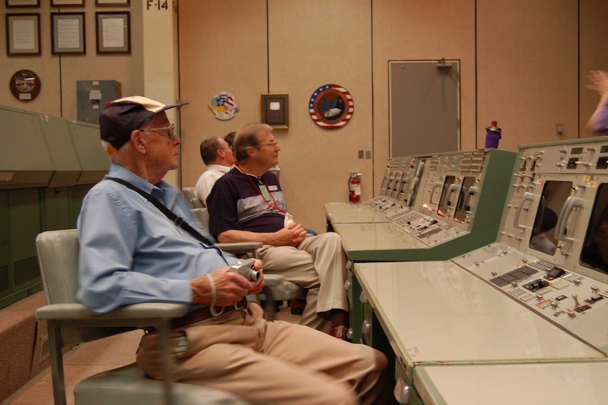 Tony Hutchison's friends listen in on a tour of NASA.