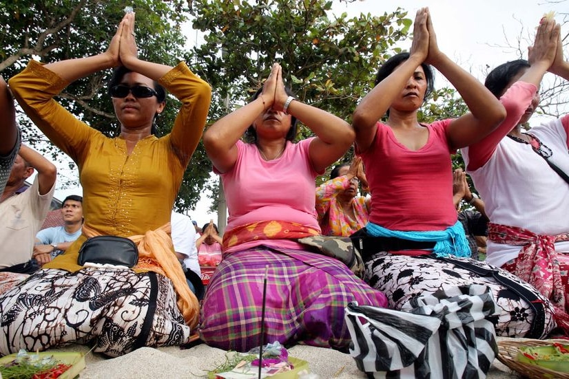 Praying for change ... Environmental activists and supporters at the UN Climate Change Conference in Bali.