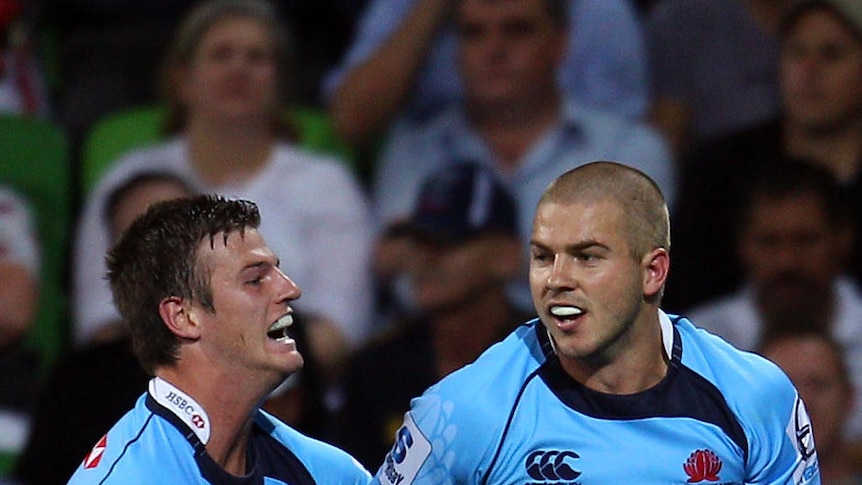 Deadly double: Drew Mitchell scored two of the Waratahs' seven tries in Melbourne.