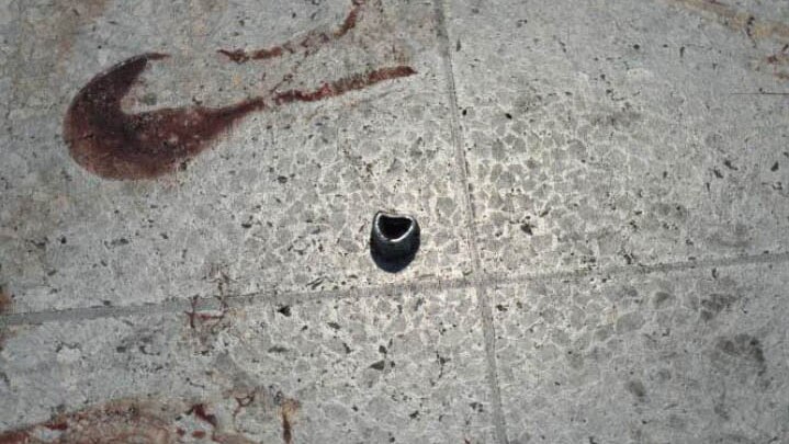 A photo published by the New York Times of a nut that may have been used as shrapnel next to some blood.