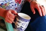 hands holding a tea cup