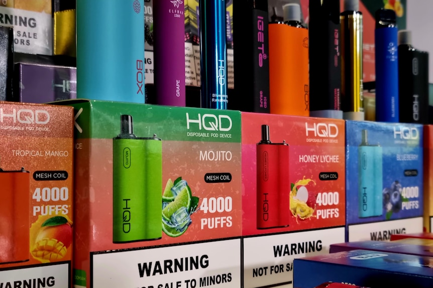 Boxes of vapes stacked next to each other on display