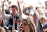 Gutted ... a Collingwood supporter shows her disbelief at the Sidney Myer Music Bowl in Melbourne.