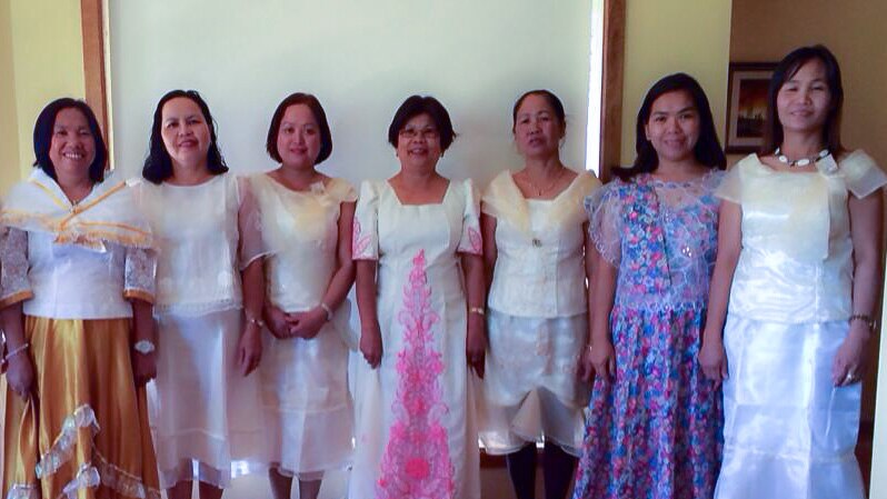 The Riverland Filipino Chorus performing in their traditional choral outfits