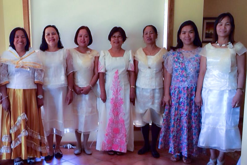 The Riverland Filipino Chorus performing in their traditional choral outfits