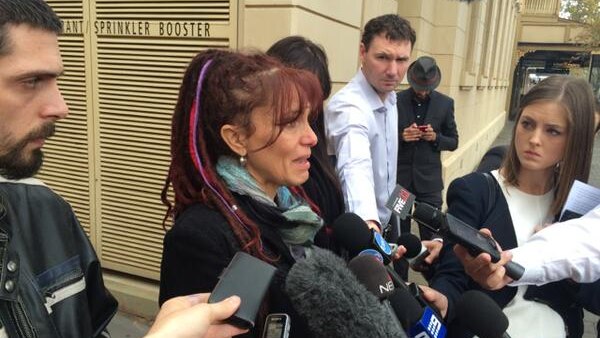 Belinda Valentine fights back tears outside court after coroner hands down findings