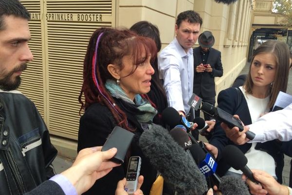 Belinda Valentine fights back tears outside court after coroner hands down findings