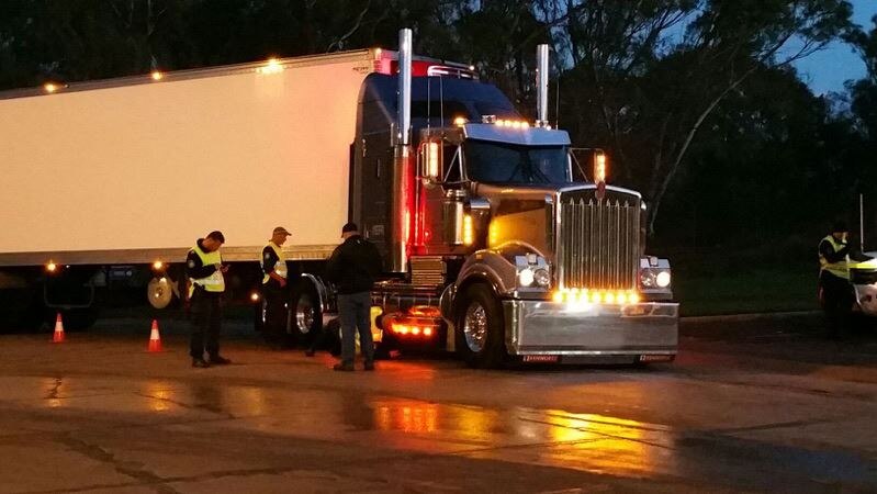 Baiada trucks being searched by NSW Police.