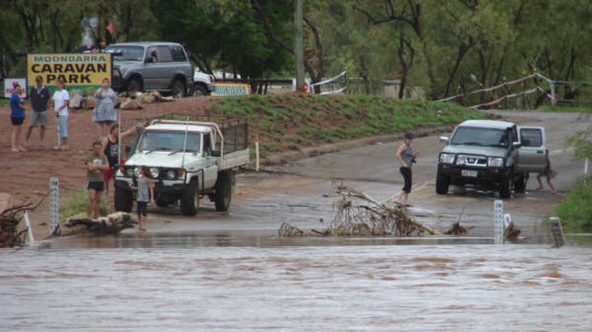 Roads to several towns are cut by floodwaters.