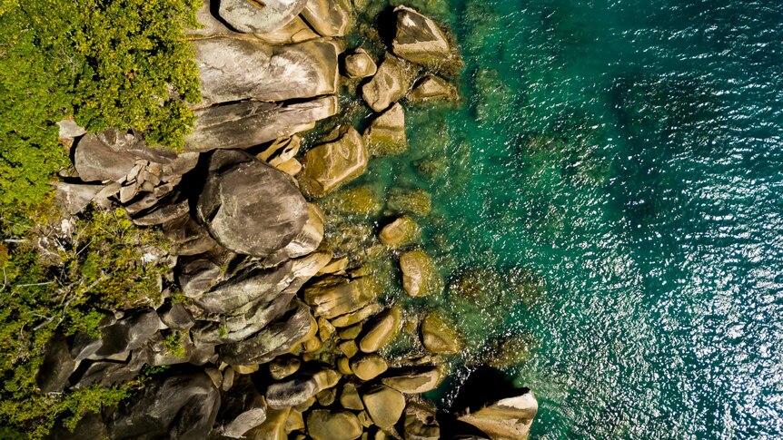 Aerial view of rocks in the water