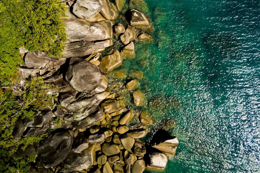 Aerial view of rocks in the water