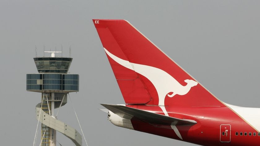 The tail of a Qantas plane featuring the iconic kangaroo logo.