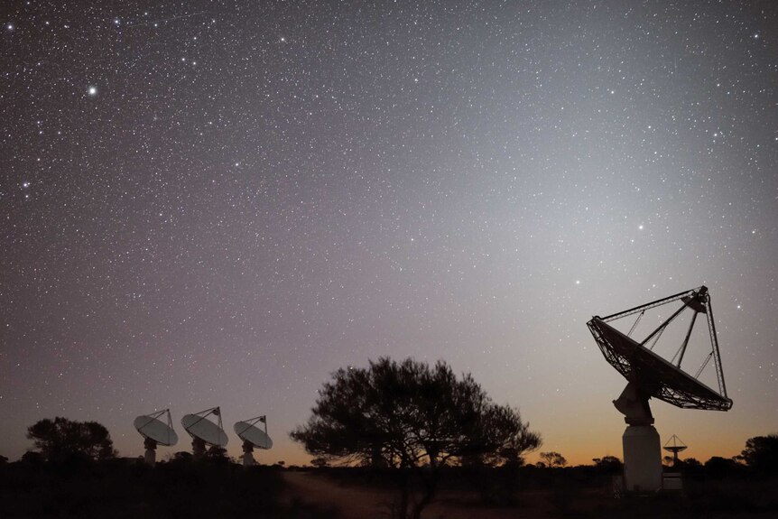 Under a brilliant night sky, ASKAP telescopes are pointed to the night stars