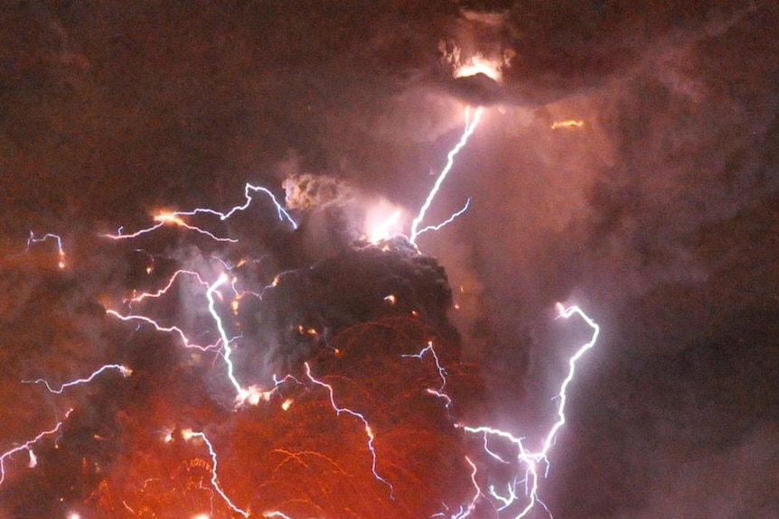 Volcanic lightning strikes above Shinmoedake peak as it erupts