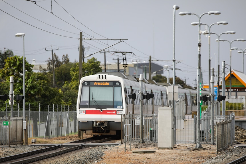 A Transperth train pulling into a station.