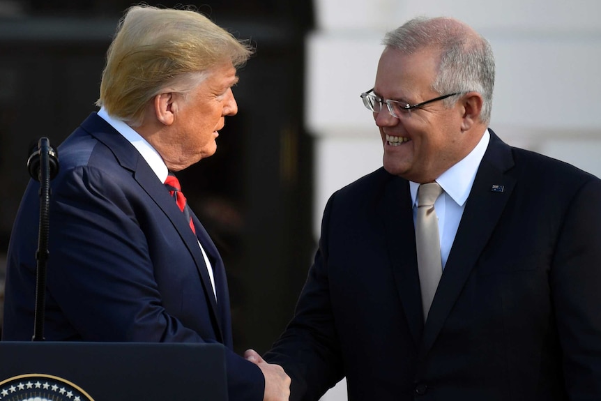 Trump and Morrison greet each other outside the White House