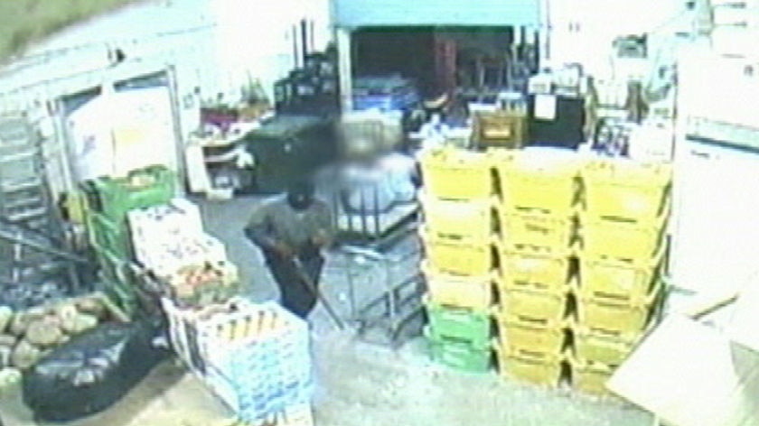 Armed robbery on Quinns Rocks supermarket (CCTV still)