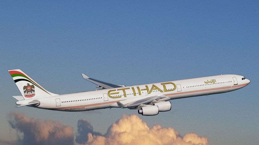 An Etihad jet in mid-flight.