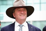 Barnaby Joyce wears an akubra, speaks about the sugar tax outside Parliament house