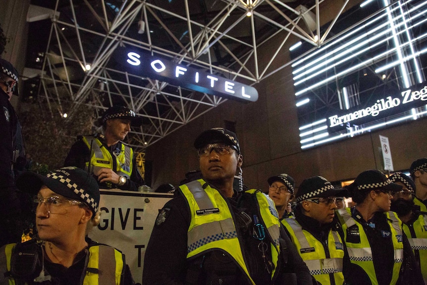 Police form a line outside the event venue