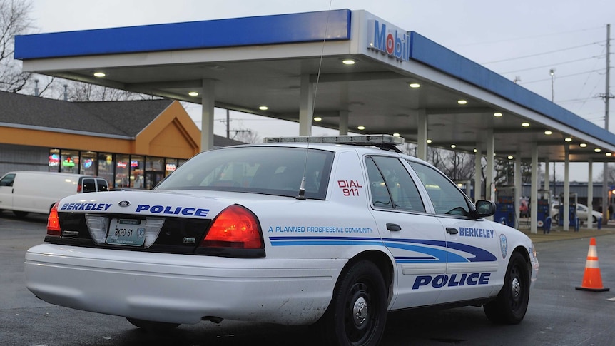 American police car at a petrol station