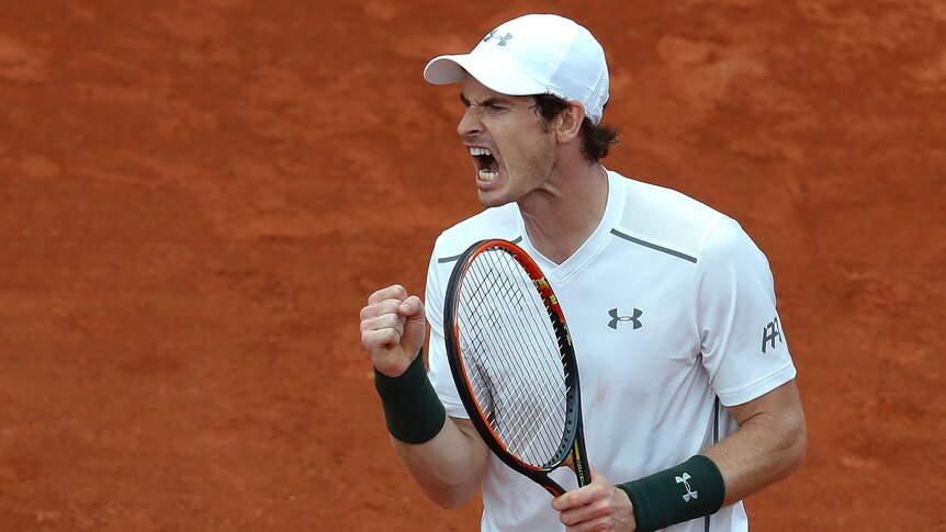 Andy Murray reacts during his French Open second round match against Mathias Bourgue.