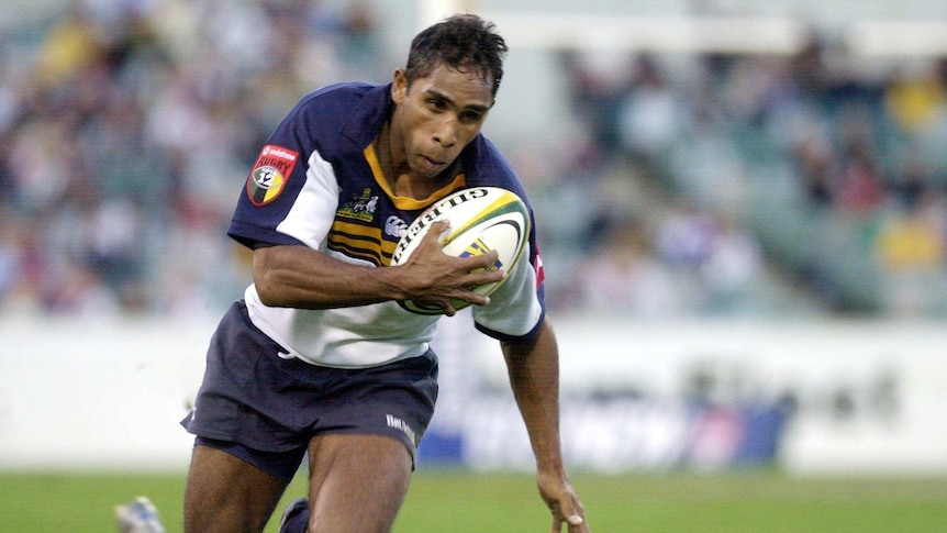 Andrew Walker races away for the Brumbies in Super Rugby game against Chiefs in Canberra in 2003.