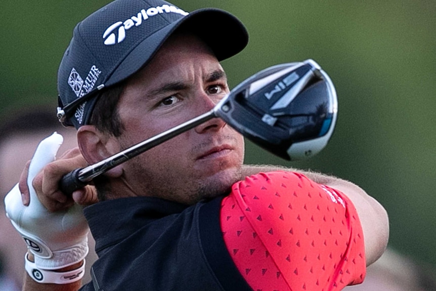 Lucas Herbert holds a pose after playing a shot