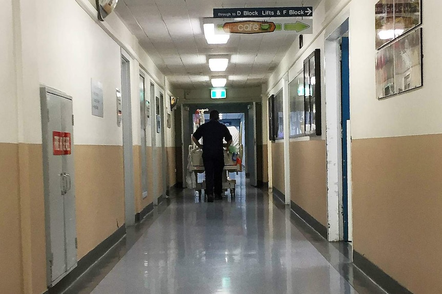 Patient being wheeled down corridor at Royal Hobart Hospital