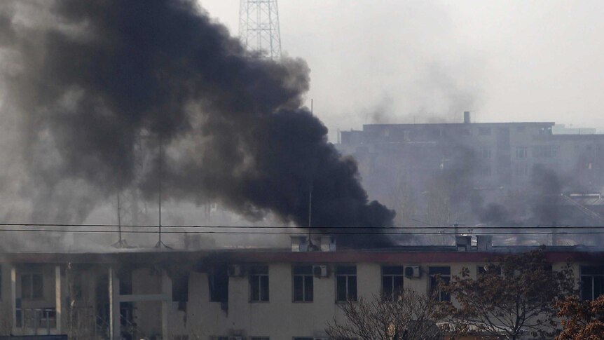Smoke pours from the traffic police headquarters in Kabul
