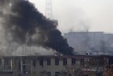 Smoke pours from the traffic police headquarters in Kabul