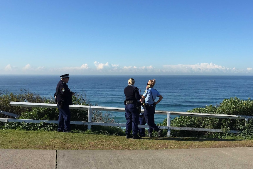Police above Susan Gilmore Beach where the man's body was found on July 10.