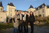 Lam Kok (second from right) celebrates his purchase of the Chateau de La Riviere on Friday.