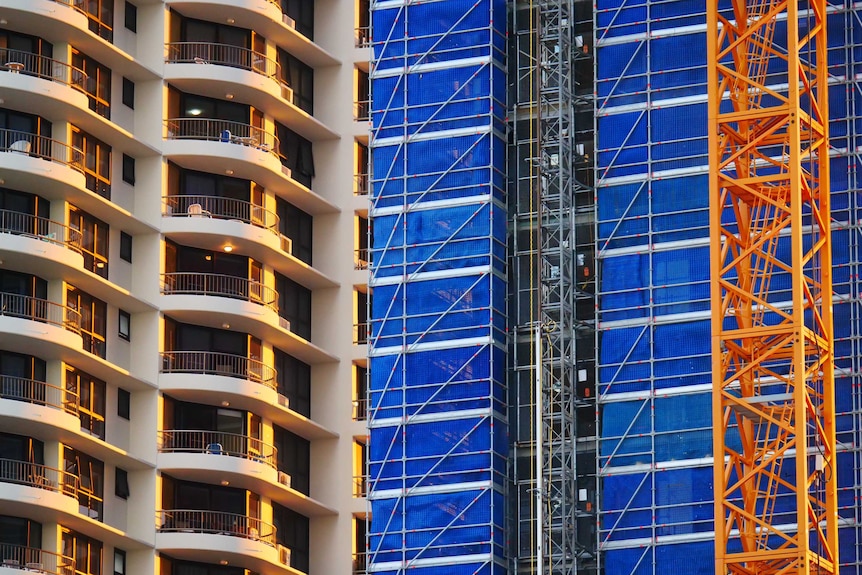 two building close up scaffolding