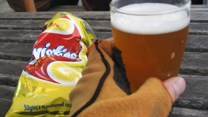 Twisties and beer on a table