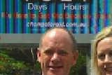 Mr Newman (centre) has launched a roadside clock in Brisbane to make a point.