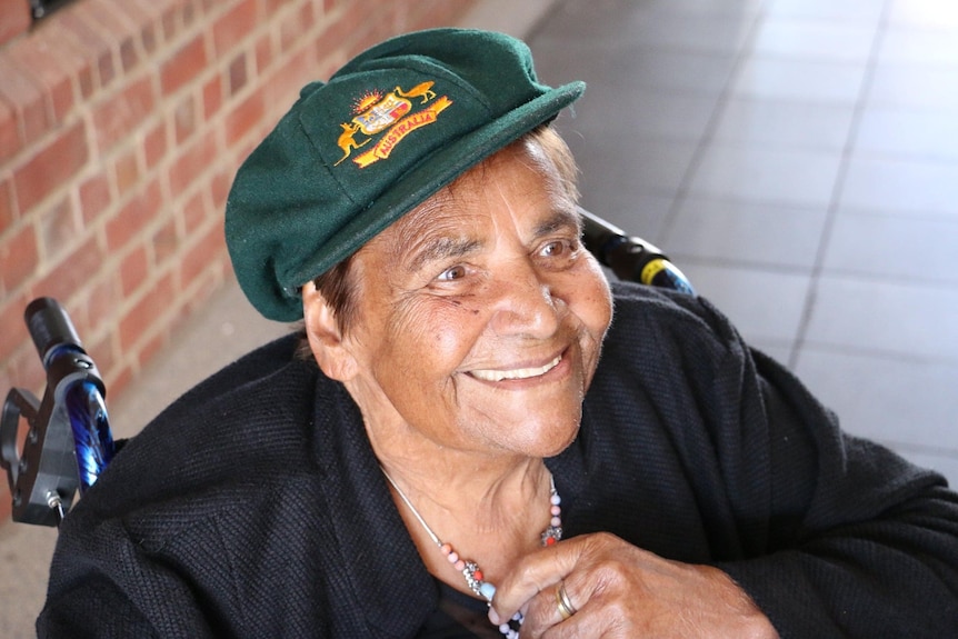 woman wearing australia cricket baggy green cap