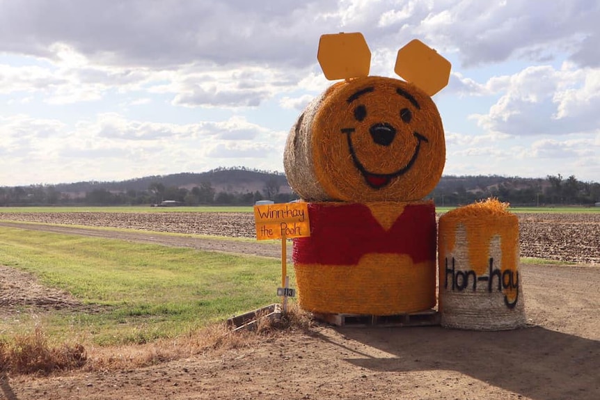 Hay bales stacked and painted to look like Winnie the Pooh
