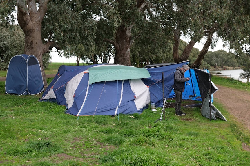 A tent set up beside a lake near Ballarat. 
