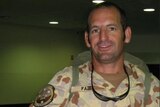 Man in uniform smiling