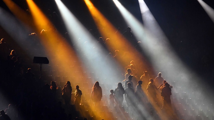 Spectators are seen leaving the stadium at the end of the closing ceremony of the XXI Commonwealth Games