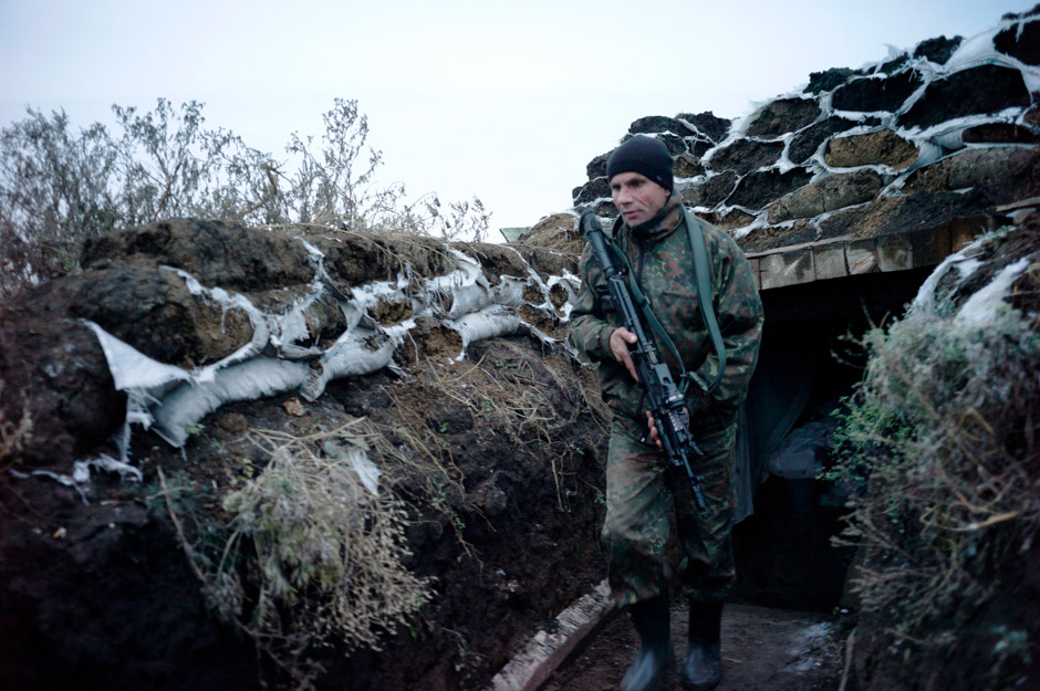 A Marine rushes from his bunker to take a new position at station Tiger.